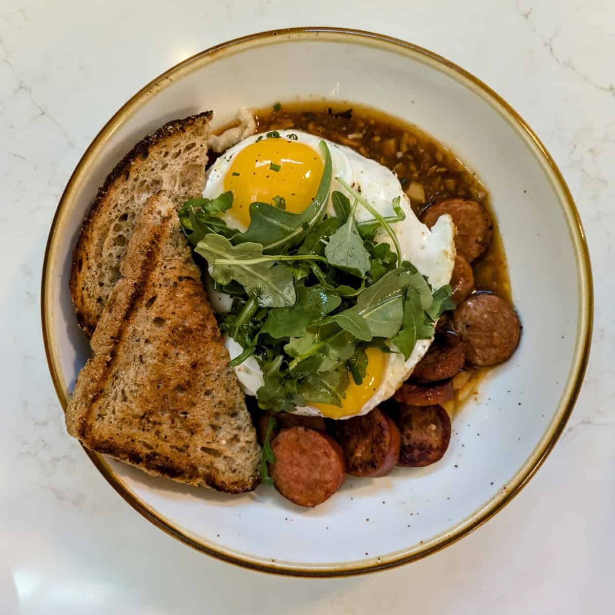 Cheese grits breakfast bowl at Crawford's Genuine RDU Restaurant